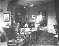 James Ballantyne in chair at 54 Main - 1889