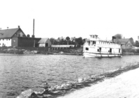 Steam Boat Olive on canal 1891 - building possibly the cannery at Dow's Lake