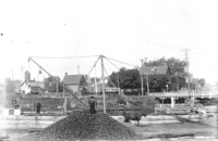 Loading coal near swing bridge in 1901