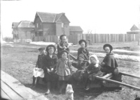 Children near town hall - possibly Seventh St. - 1904 - note wooden sidewalk