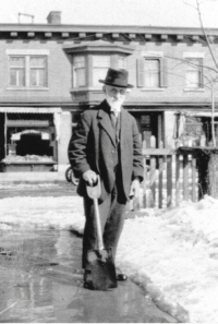 The last picture of James in front of 54 Main St.